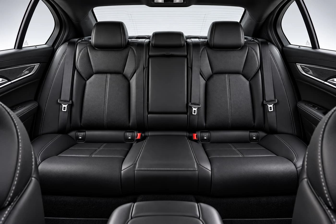 Cadillac CT5 rear black leather seats with headrests and seatbelts.