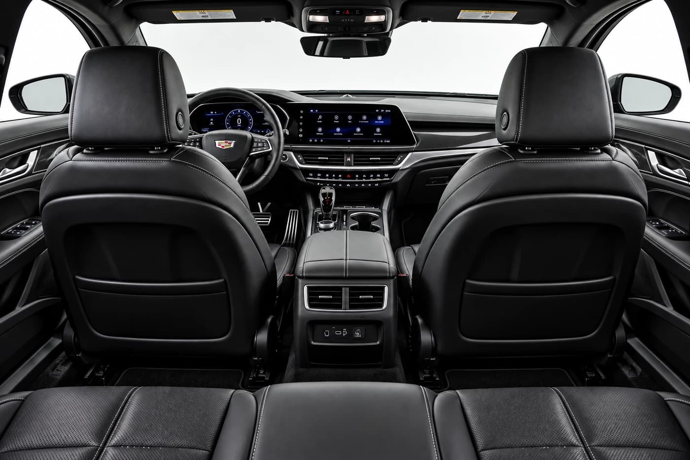 Cadillac CT5 front cabin with black leather seats, steering wheel and dashboard.